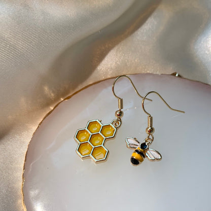 Cool quirky yellow and black gold bee drop dangle earrings with yellow honey comb