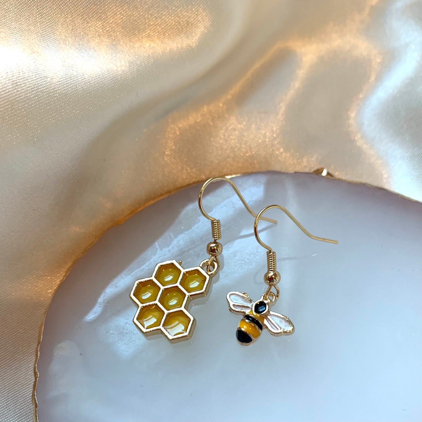 Cool quirky yellow and black gold bee drop dangle earrings with yellow honey comb