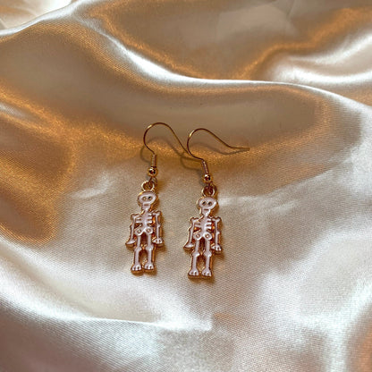 White cartoon skeleton Halloween gold earrings
